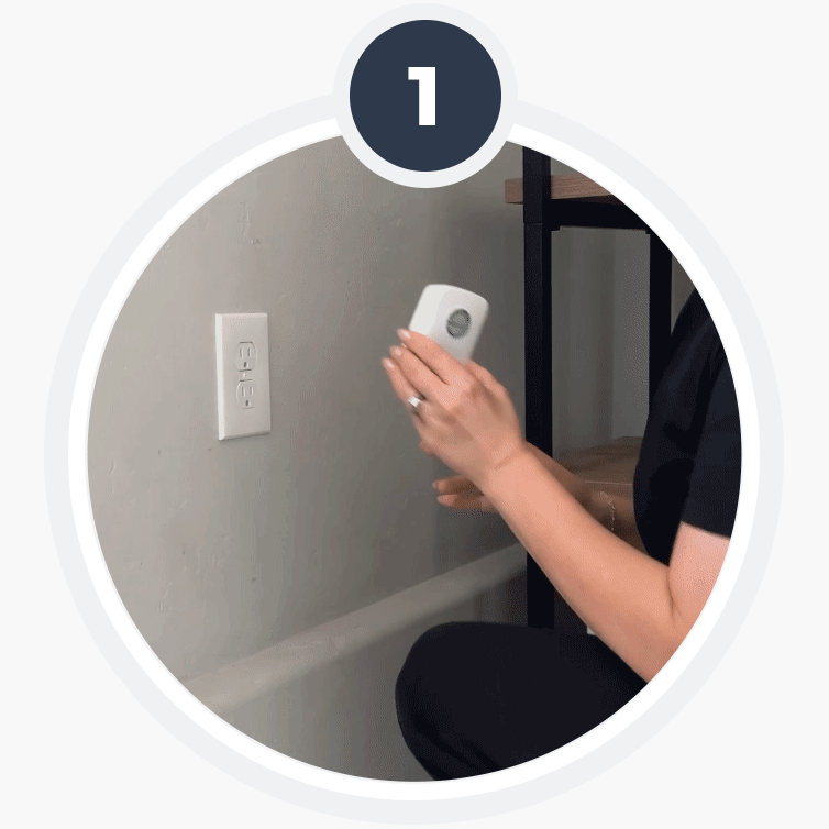 StopWatt being plugged into a wall outlet